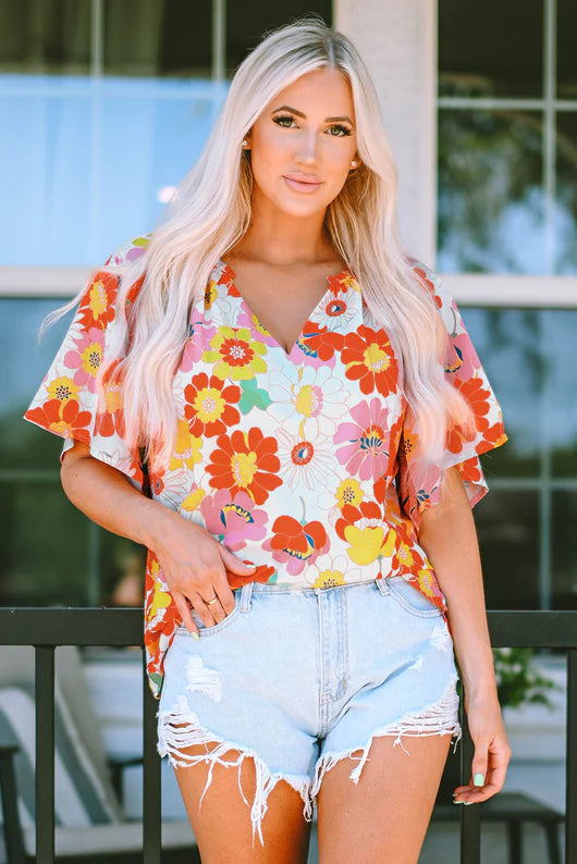 Orange Abstract V Neck Half Sleeve Blouse